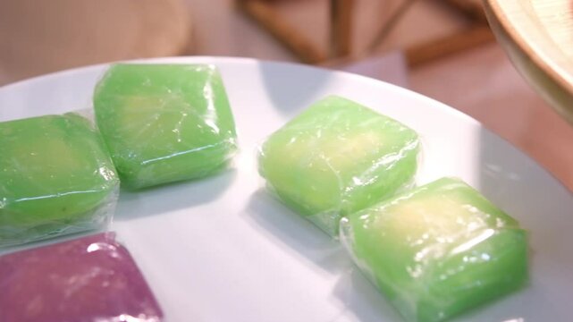 traditional food tape uli and black sticky rice, Indonesian Sweet and savory dessert, Tape is made of fermented black glutinous rice, Ketan Uli is made of steam glutinous rice cake wrapped 