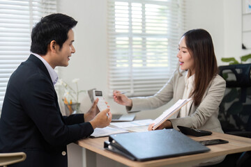 Financial Consultation. Professional meeting between financial advisor and client discussing investment strategies.