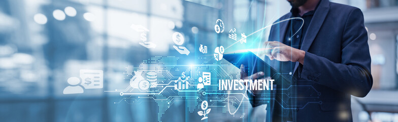 Businessman using tablet analyzing investment and market growth trends to optimize portfolio performance and maximize returns through strategic financial planning and data-driven decision making.