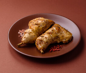 Grilled chicken leg or quarter. Barbecued meat with salt and spices