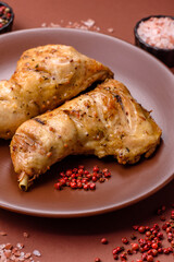 Grilled chicken leg or quarter. Barbecued meat with salt and spices