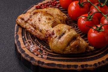 Grilled chicken leg or quarter. Barbecued meat with salt and spices