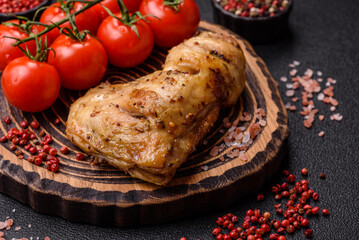 Grilled chicken leg or quarter. Barbecued meat with salt and spices