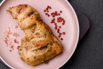 Grilled chicken leg or quarter. Barbecued meat with salt and spices
