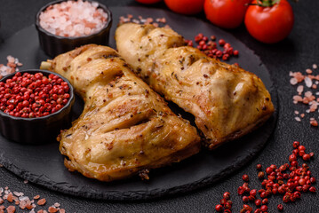 Grilled chicken leg or quarter. Barbecued meat with salt and spices