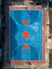 Top view of a basketball court in blue and red color.