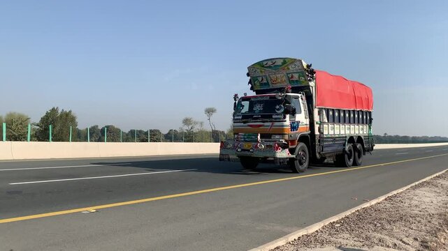 PAKISTAN PUNJAB 2024 19 MAY: Truck. Pakistani Truck on the motorway towards Lahore ring road. CPEC. China to Pakistan. loading truck with gas and oil. Transportation. Pakistani transport. Motorway M5.