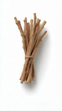 Bundle of dried wooden miswak sticks, tied together with twine, creating a natural and oral hygiene dental care concept.