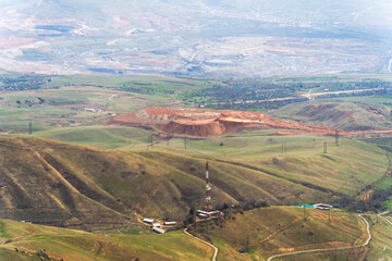 Naklejka premium Aerial view of open pit mining near Angren, Uzbekistan, in Spring.