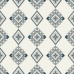 Repeating ethnic geometric diamond pattern with Navajo motifs in soft ivory and dark navy tones. Great for wallpaper, textile prints, and surface design.