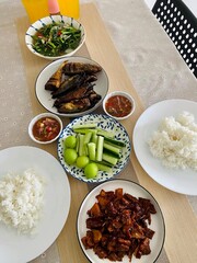 Traditional Malaysian Nasi Ulam Budu with Rice and Side Dishes