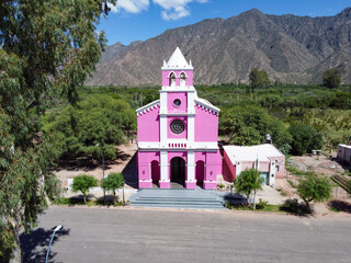 The Church of Our Lady of Candelaria in Copacabana, Tinogasta, emerges among mountains with its...