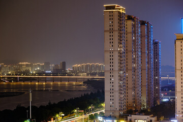 Wenzhou's Illuminated Skyline at Twilight: Riverside Towers and Urban Glow