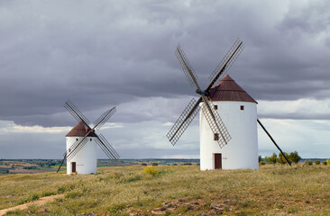 In a place in La Mancha where the windmills are bathed in the sun