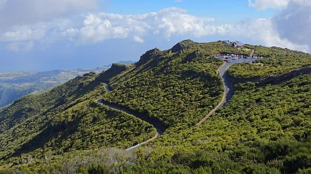 Curvy road to Pico do Arieiro on Madeira Island, Portugal, offers dramatic views and leads hikers toward the epic mountain trail to Pico Ruivo, the island&rsquo;s highest point.