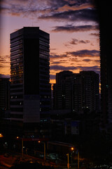 Capturing the Shenzhen Dusk: Urban Towers Silhouetted Against a Dramatic Sky