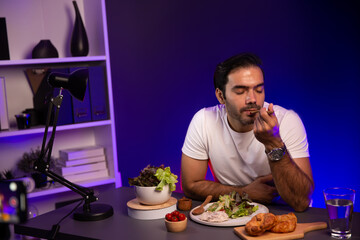 Healthy influencer in host channel tasting chicken meat ingredient health on diet life in mixed salad for easy cooking product by self with tasty food on social media live on meal time. Surmise.