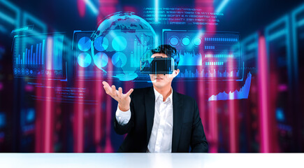 Smart project manager looking and holding business data and checking financial chart. Smart business man wearing augmented reality goggles by using artificial intelligence planning plan. Ingenuity.