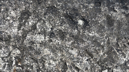 Detailed Texture of Dark Natural Stone Surface with Intricate Patterns. Rough natural stone background