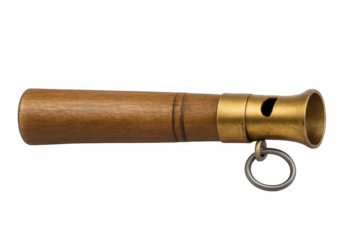 Studio shot of a vintage whistle made of wood and brass, featuring a ring for attachment, isolated on a transparent background