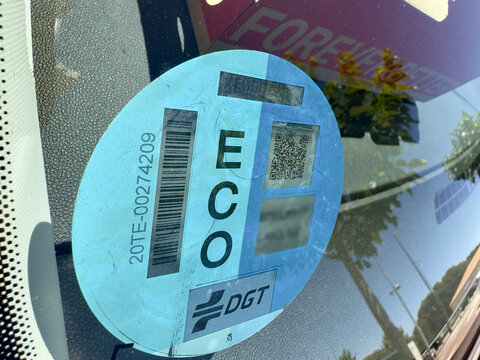 Zaragoza 17 May 2025, ECO label on the windshield of a hybrid car