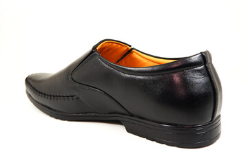 A formal black shoe isolated on white background closeup view 