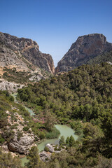 Vertical Landscape of View from Caminito del Rey in Andalusia. Beautiful Scenery with Green River and Mountain Rocks in Province of Málaga.