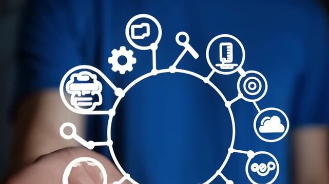 Hand presenting mes circle with icons on blue shirt background in a close up shot of technology