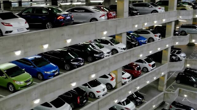 Timelapse of multilevel urban parking garage with changing light