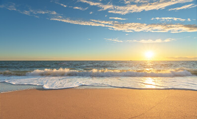 Sandy seashore at sunset.