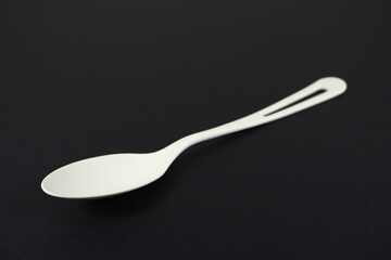 spoon on black background closeup view 