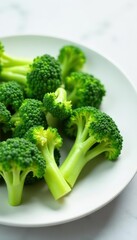 Pale green blanched broccoli florets arranged on a white plate , recipe, culinary, white plate