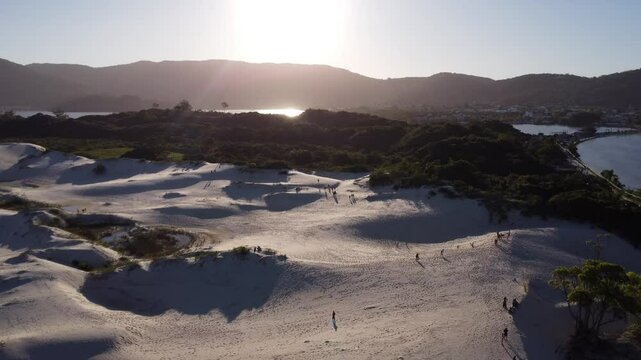 4K Drone Slow Pullback Over Sunset Dunes in Lagoa da Concei&ccedil;&atilde;o, Florian&oacute;polis, Brazil