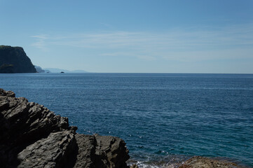 View of calm blue sea, blue clear sky and mountains, beautiful horizon, relaxation on the Adriatic coast