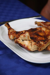 Crispy Fried or Roasted Meat Dish with Traditional Garnishes