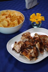 Crispy Fried or Roasted Meat Dish with Traditional Garnishes