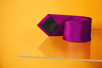 A purple tie rolled up closeup view , Tie macro photography 