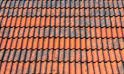 Fototapeta premium Old zinc vintage fence wall texture for background, pattern of rusty on metal panel. Tin roof texture of an old rusty house full frame background. Tin roof wall countryside.