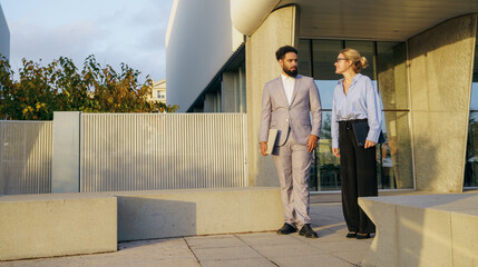 A group of professionals walking in a vibrant urban environment, showcasing teamwork