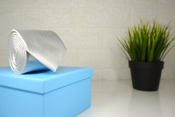 Plain polyester tie rolled up closeup view, Tie macro photography