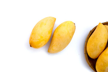 Ripe sweet yellow mango fruits on white