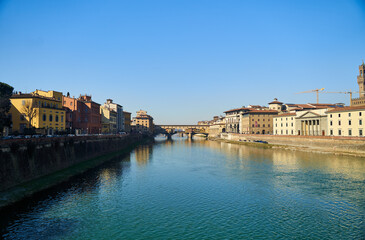 Obraz premium View of the river Arno and buildings from the embankment in Florence. High quality photo