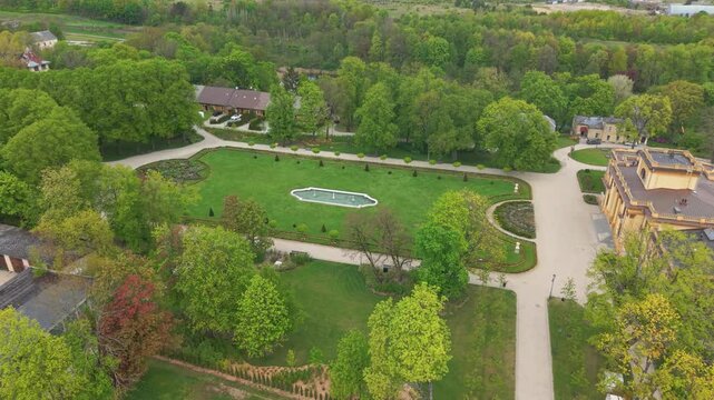 Drone footage of a Traku Voke Manor heritage museum in Vilnius, Lithuania with green lush landscape