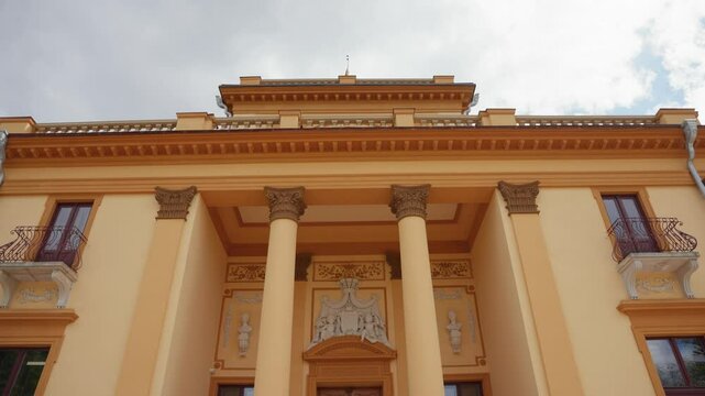 Drone footage of a Traku Voke Manor heritage museum in Vilnius, Lithuania with green lush landscape