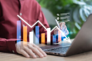 Goal setting to reduce costs and increase product value concept, Businesswoman shows graph compare...