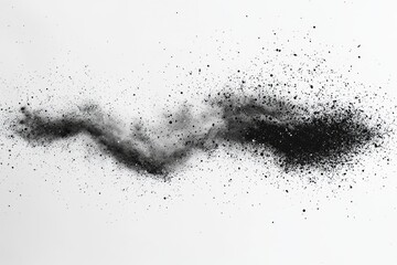 Abstract black powder explosion on a white background.