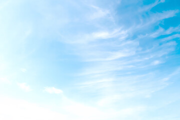 Soft clouds on bright blue sky light background