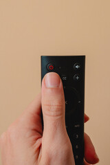 Power button. Human pressing the power button. Equipment control
