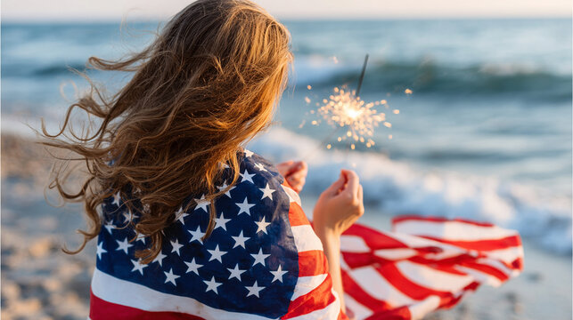 Young woman holding american flag and little light sparkle. 4th of July.Independence Day. Patriotic holiday, memorial day. 