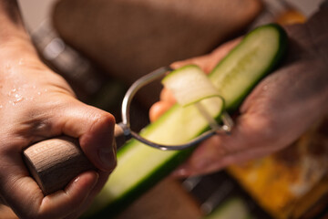 Detailed View of Slicing a Cucumber